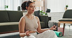 Woman, lotus and peace for spiritual wellness in home, meditation and healing for mental health. Female person, zen and breathing on floor to relax chakra energy, calm and mindfulness for harmony