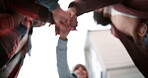 Outdoor, support and hands of family in stack for fun bonding or playing in nature together. Teamwork, huddle and low angle of people on holiday vacation with solidarity, parents or kid for wellness