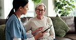 Senior, woman and nurse on sofa with tablet, healthcare and consultation for diagnosis in nursing home. Lounge, professional and medical caregiver or talking, patient and telehealth app for results