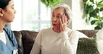 Women, nurse and senior patient with chat in retirement home on sofa for help, support and illness symptoms. People, caregiver and pensioner for checkup or consultation for health and wellness