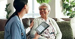 Nurse, elderly care and tablet as caregiver in retirement for health, wellness or schedule in nursing home. Woman, senior person and support for Dementia, age related illness and memory on technology