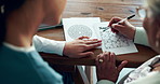 Assessment, brain game and senior woman hands with nurse in retirement home with paper. Memory activity, monitor and Alzheimers test for neurology, problem solving and cognitive function with nursing