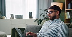 Serious, man and laptop for remote work at house for research, information and schedule of website designer. Male person, digital and typing for email, feedback and communication of project report