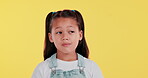 Girl, kid and thinking in studio with smile for wonder, curiosity and contemplating on solution. Question, doubt and child with idea on mockup for choice, decision and emoji on yellow background