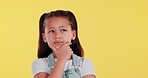 Girl, question and thinking or idea on studio background with confused face for education or learning. Student or kid with doubt, trying to remember or process information for memory, ADHD or autism