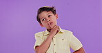 Wonder, kid and hand with thinking in studio for question, confused and doubt in decision by mockup. Curious, little boy and gesture with contemplating for plan, solution or idea on purple background