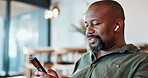 Black man, relax and earphones with music on phone for streaming video, podcast and networking on social media. African, male person and mobile for listening, playlist audio and dancing at home