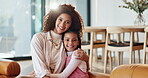 Face, mother and girl on sofa with hug, connection and bonding together with smile in home. Happy family, mom and child on couch in living room, love and relationship of kid with parent in house