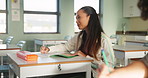 Girl, student and book for writing in classroom with school education, learning and knowledge. Female pupil, desk and notes for english essay with scholarship, studying and remember for information