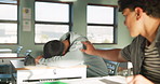 Tired, boy and sleeping in class at desk for learning, development and fatigue in education. Bored, teen and friends with wake up at high school for morning lesson, knowledge or exhausted in studying