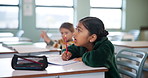 Girl, writing and classroom for education at school with learning, knowledge and information of exam assignment. Student, drawing and paper for lesson, assessment and creative activity of development