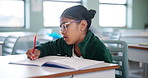 Girl, drawing and classroom for education at school with learning, knowledge and information of creative exam. Student, writing and paper for lesson activity, assessment and future development