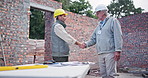 Blueprint, handshake and team for construction, architect and meeting for real estate development. Hardhat, protection and brick building for male people, partnership and inspection by specialist