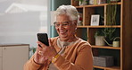 Senior woman, mobile and typing in house with happiness for conversation, funny and good news. Elderly person, smartphone and speaking with smile or excited for gossip, chat and social media meme