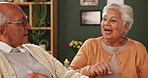 Senior couple, talking and bonding in house with love in retirement for marriage, happiness and funny. Elderly people, joke and smile in living room with care, support and trust for conversation