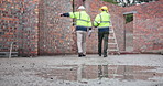 Walking, inspection and construction engineers on site with blueprint for building or renovation. Industry, collaboration and contractor with civil worker planning for home repairs or development.
