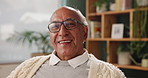 Senior man, home and happy for retirement as pensioner to relax, enjoy and satisfied with break. House, portrait and smile for me time with peace, calm and fun in living room on wellness and positive
