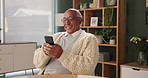 Senior man, chat and typing on phone in house with happiness for conversation, funny and good news. Elderly person, smartphone and speak with smile or excited for gossip, comedy and invite to reunion