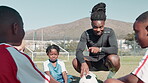 Coach, children and motivation talk for soccer, junior league and teamwork competition or training on football field. People, team and coaching for outside exercise, match strategy and kids together