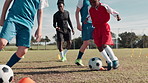 Soccer, sports and children with ball for practice, workout and exercise for training, learning and fitness. Youth, field and kids with coach and equipment for playing games, match and competition