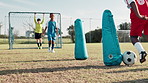 Soccer ball, sports and children on field for training, workout and exercise for practice, learning and fitness. Goal, net and kids with coach and equipment for playing games, match and competition