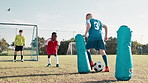 Soccer ball, sports and children with net for practice, workout and exercise for training, learning and fitness. Skills, field and kids with equipment for playing games, match and competition