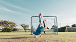 Soccer field, goal and kid with bicycle kick in post for practice, exercise and development of skills. Children, ball and boys with outdoor sport on grass for aim training, workout and score in net