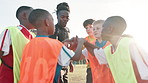 Football, hands and coach with children for celebrate, motivation and team spirit for sport competition. Soccer field, applause and trainer with players for win, achievement and confidence boost