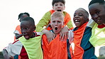 Face, group and boy with celebration, soccer and achievement with contest, tournament and cheering. Portrait, kids or children with sports, training or football game with players, excited or champion