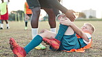 Football, player and knee pain for injury, accident and muscle tension during kick in sports competition. Soccer field, hands and coach with boy for helping, support and patellar tendinitis for kid