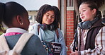 Girl, children and talking in school corridor with book for biology lesson, learning support and education. Friends, student and discussion in hallway for exam information, study and future career