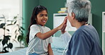 Girl, doctor and high five in hospital for health, wellness and medical advice with consultation or checkup. Child, pediatrician and sick with support in clinic for results and healthcare assessment 