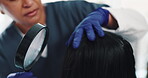 Magnifying glass, woman and doctor with hair, diagnosis and haircare for patient and consultation in clinic. Texture, damage and burning of scalp, hand and inspection of infection by trichologist