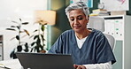 Thinking, woman and nurse with laptop in office for medical solution, reading information and schedule surgery. Person, digital and typing for Telehealth, history record and test results at clinic