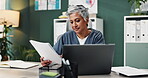 Nurse, woman and documents with laptop in office for healthcare research, reading information and schedule surgery. Mature, doctor and digital for Telehealth, history record and results at clinic