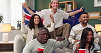 Flag, sports and people with celebration on sofa for athletics, competition or live stream. Diversity, fans and cheering friends with watching tv at home for sport, champion or success in New Zealand