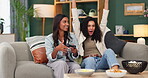 Gaming, celebration and people with controller on sofa for competition, entertainment or success. Home, women and friends with technology in living room for multiplayer, victory or winning in contest