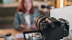 Video camera, equipment and influencer in house for content creation, feedback or network communication. Social media, vlog and woman with gaming, advice or filming headset review for podcast