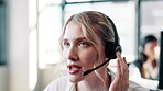 Face, woman and help desk at call center with customer or client for support and service. Office, crm and advisor or consultant with smile for conversation, telemarketing and advice with microphone