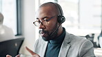 Call center, black man and talking on microphone for support, help desk and advice for customer service. Telemarketing, male agent and consulting for business crm, FAQ questions or about us in office