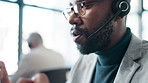 Call center, black man and consulting on microphone for support, help desk and advice for customer service. Telemarketing, male agent and talking for business crm, FAQ questions or about us in office