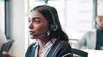 Employee, Indian woman and microphone at call center with chat for customer support and service. Office, crm and advisor or consultant in conversation, telemarketing and communication at help desk