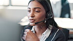 Employee, Indian woman and computer at call center with microphone for customer support or service. Office, crm and advisor or consultant in conversation, telemarketing and communication at help desk