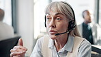 Face, mature woman and microphone  at call center with chat for customer support and service. Office, crm and employee or consultant in conversation, telemarketing and communication at help desk