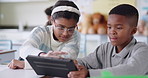 School kids, students and tablet in classroom for playing, learning and typing on digital software with interactive game. Children problem solving, typing and talking of teamwork and online education