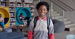 Black boy, student and backpack in library for education, learning development and happy with scholarship. Scholar, person and smile with back to school for studying, knowledge academy and growth