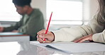 Girl, hands and writing a test in class, education and book for notes to study or project at school. Female person, assignment and learning at academy, knowledge and lesson for student development