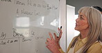 Teacher, students and woman for education presentation on whiteboard of lecture, math information and solution. Professor, diverse and people for assessment mentoring, advice and university knowledge