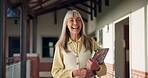 Walking, happy and teacher on campus with books for knowledge, career and education. Woman, pride and professor or employee for development, curriculum or lecture for English academy or university