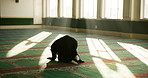 Muslim person, praying and back in mosque on floor with religion, faith and connection to God in morning. Islam, peace and spiritual development on carpet for pilgrimage, devotion and gratitude